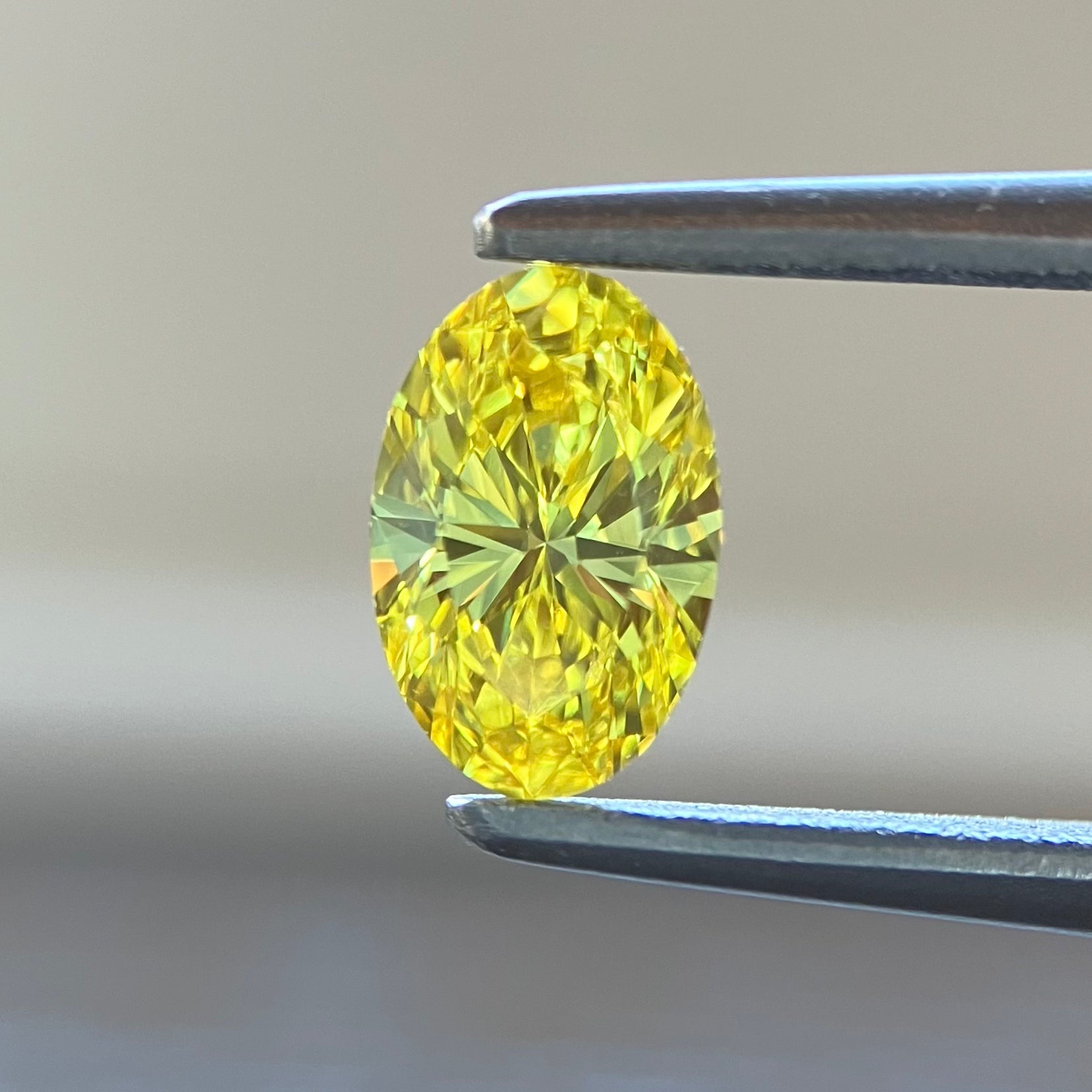 0.371ct natural color Fancy Vivid Yellow oval loose diamond