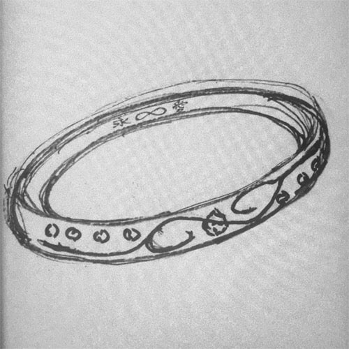 イニシャルと∞を組み合わせた結婚指輪の手書きデザイン画